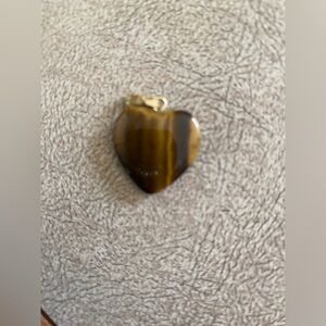 Pendant tiger eye material heart shape about 1/2 inch tall pendant only no chain